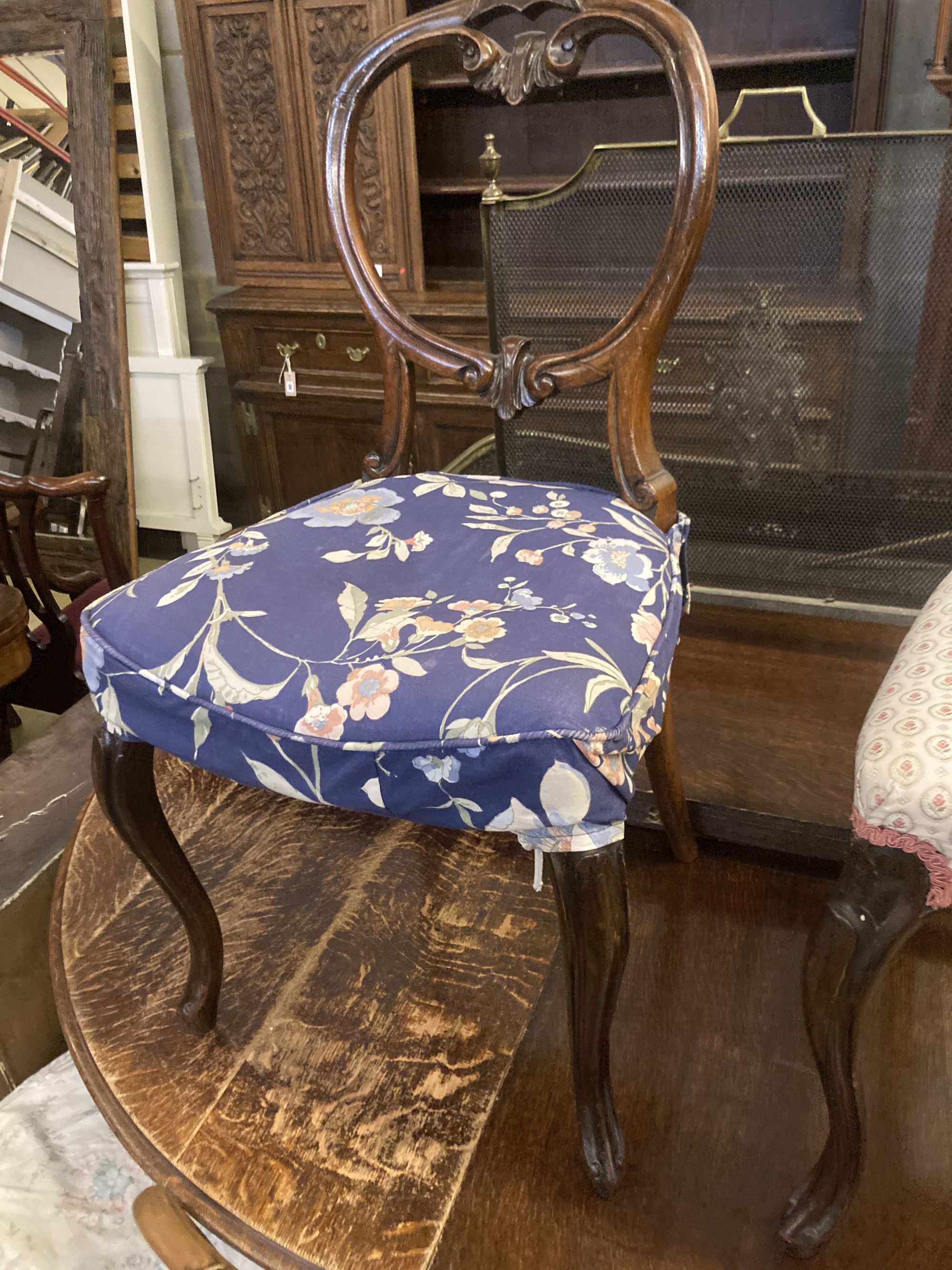 A set of six Victorian balloon back rosewood dining chairs